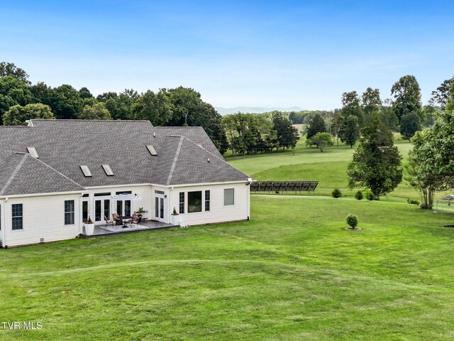 1905 Martin Rd, Limestone, TN 37681 - rear view of property featuring a lawn, a patio area, roof with shingles, french doors, and view of scattered trees