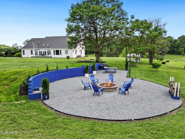 1905 Martin Rd, Limestone, TN 37681 - surrounding community featuring a fire pit, a lawn, and a patio area