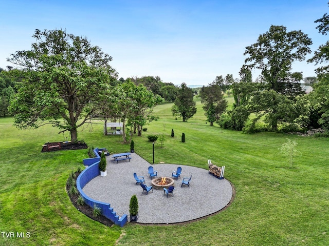 1905 Martin Rd, Limestone, TN 37681 - view of grassy yard featuring an outdoor fire pit, a patio, and view of scattered trees