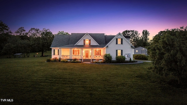 1905 Martin Rd, Limestone, TN 37681 - back of house at dusk with a porch, a yard, and a chimney