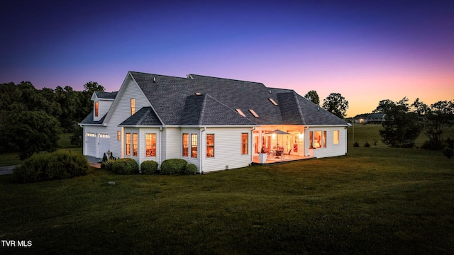 1905 Martin Rd, Limestone, TN 37681 - back of house at dusk featuring a yard and a patio area