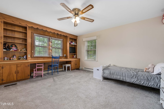 134 Parkland Dr, Bristol, VA 24201 - bedroom featuring light carpet, baseboard heating, an office area, and ceiling fan