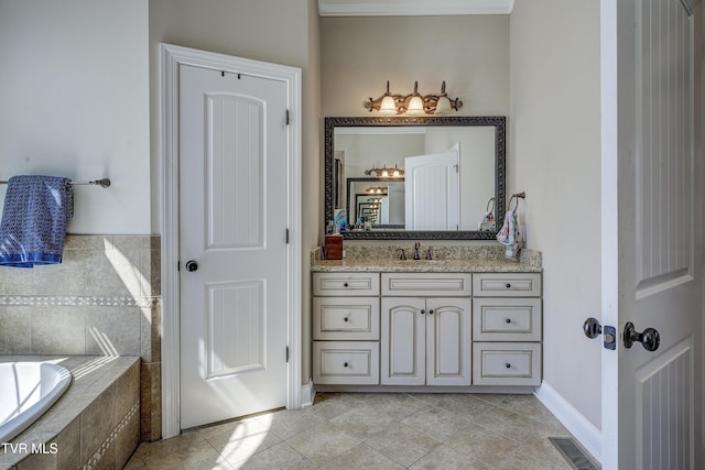 2909 Greenline Rd, Johnson City, TN 37604 - bathroom featuring vanity, a relaxing tiled tub, tile patterned floors, and baseboards