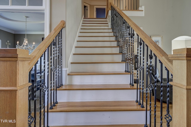 2909 Greenline Rd, Johnson City, TN 37604 - stairs with a high ceiling, a chandelier, and ornamental molding
