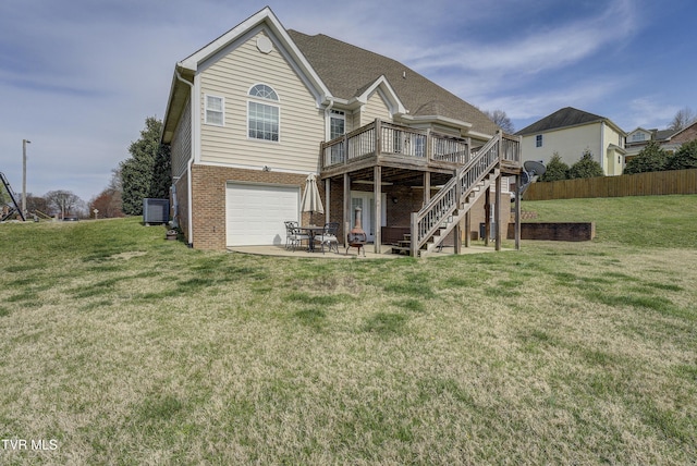2909 Greenline Rd, Johnson City, TN 37604 - rear view of house with a deck, brick siding, stairway, a garage, and cooling unit