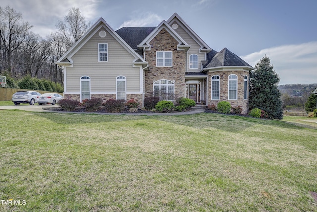2909 Greenline Rd, Johnson City, TN 37604 - view of front facade featuring stone siding, a front yard, and roof with shingles