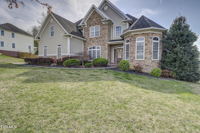2909 Greenline Rd, Johnson City, TN 37604 - view of front facade with stone siding, a front yard, and a shingled roof