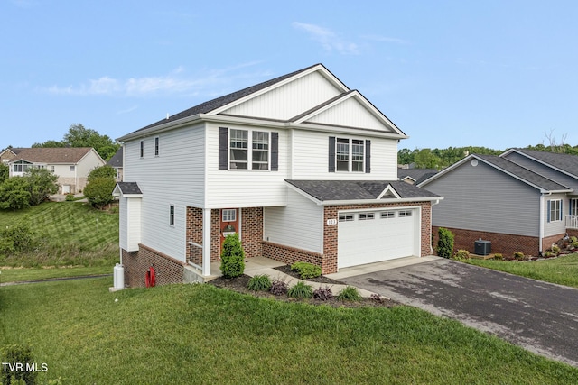 view of front of house featuring brick siding, driveway, a front yard, central air condition unit, and a shingled roof