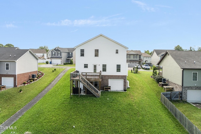 rear view of house with a residential view and a garage
