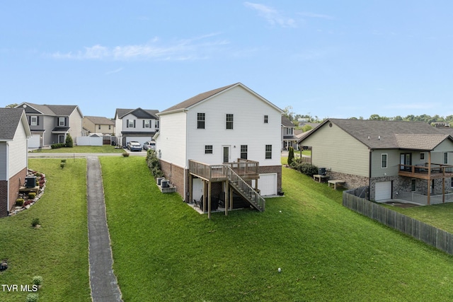 back of house with a residential view, a wooden deck, stairway, an attached garage, and brick siding