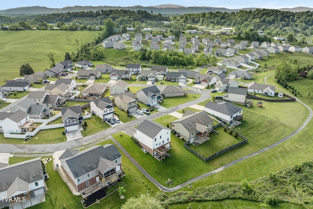 aerial view of residential area featuring a mountainous background
