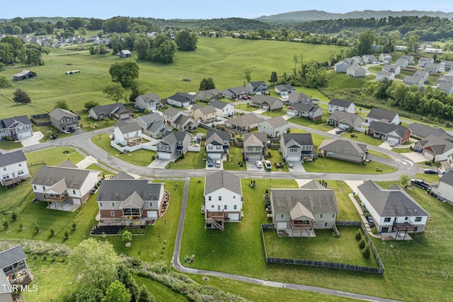 view of property location with nearby suburban area and a mountainous background