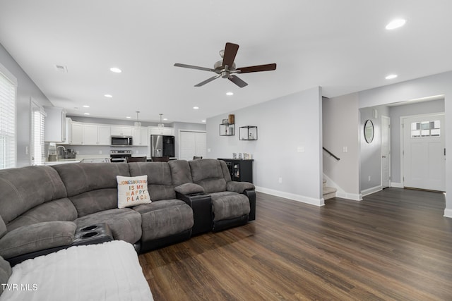 living area featuring dark wood finished floors, stairs, recessed lighting, a ceiling fan, and baseboards