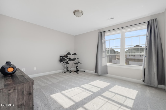 miscellaneous room with carpet floors and baseboards