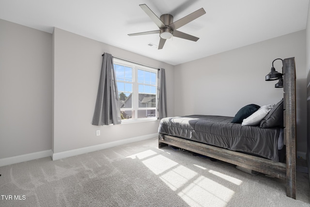 bedroom with baseboards, carpet flooring, and ceiling fan