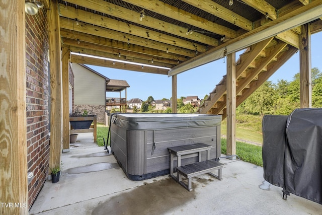 view of patio featuring a hot tub and grilling area