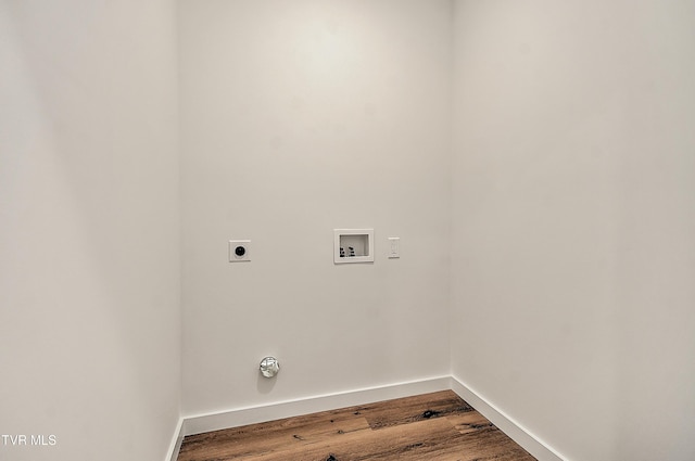 laundry area with electric dryer hookup, hookup for a washing machine, baseboards, and dark wood-style flooring