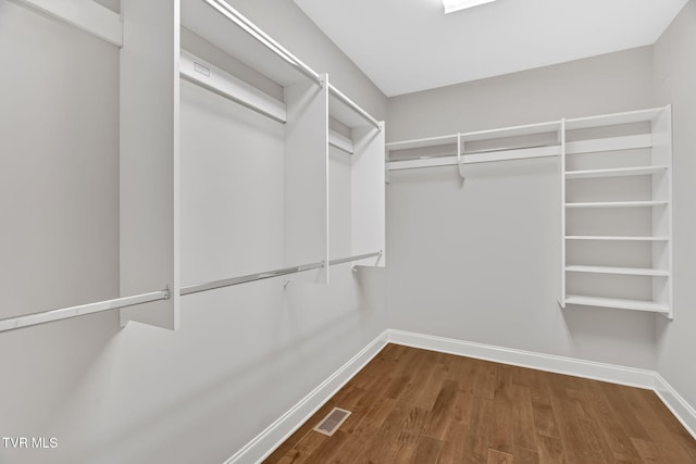 spacious closet with wood finished floors