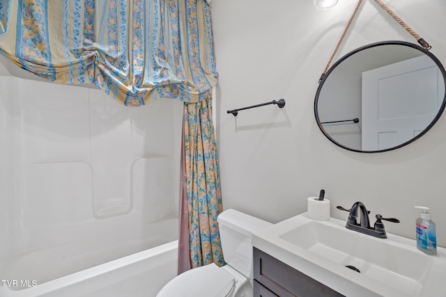 full bathroom with shower / tub combo, toilet, and vanity