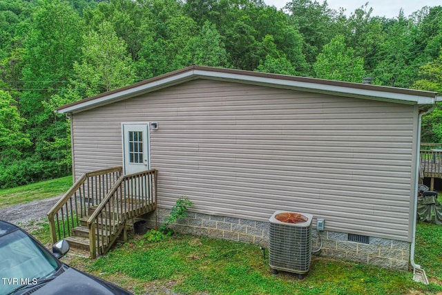 596 Devils Nose Rd, Rogersville, TN 37857 - view of home's exterior featuring crawl space, central air condition unit, and a view of trees