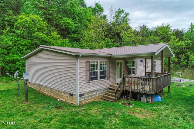 596 Devils Nose Rd, Rogersville, TN 37857 - view of front of home featuring crawl space, a front yard, metal roof, and a deck