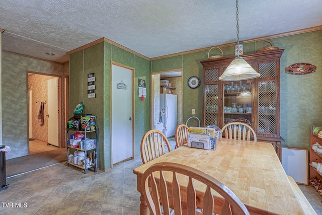 596 Devils Nose Rd, Rogersville, TN 37857 - dining space featuring a textured ceiling, ornamental molding, and water heater