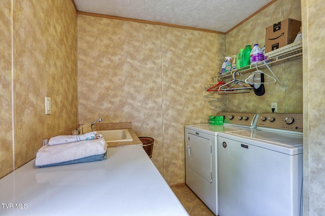 596 Devils Nose Rd, Rogersville, TN 37857 - clothes washing area featuring washing machine and clothes dryer, ornamental molding, and a textured ceiling