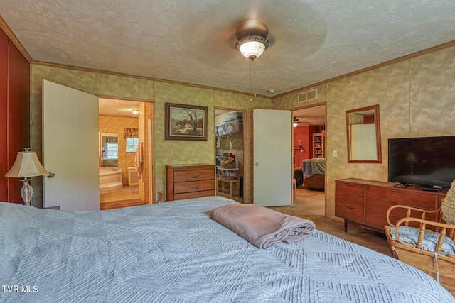 596 Devils Nose Rd, Rogersville, TN 37857 - carpeted bedroom with crown molding, a textured ceiling, and connected bathroom