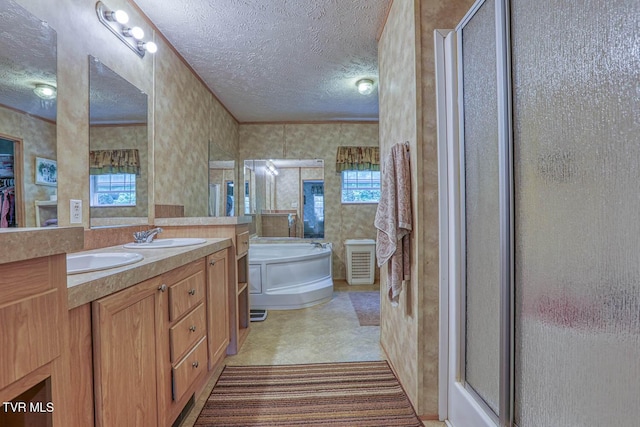 596 Devils Nose Rd, Rogersville, TN 37857 - bathroom with a textured ceiling, a stall shower, a garden tub, wallpapered walls, and double vanity