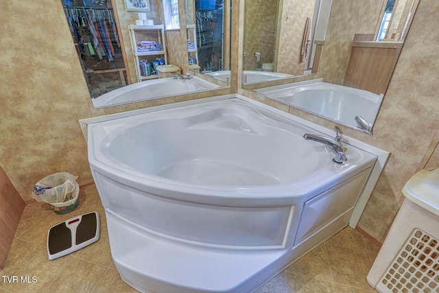 596 Devils Nose Rd, Rogersville, TN 37857 - full bath with tile patterned floors, toilet, and a garden tub