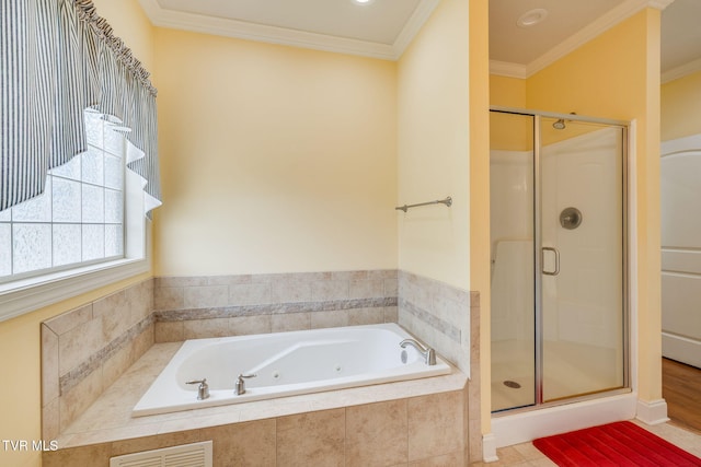 full bath with a whirlpool tub, crown molding, and a stall shower