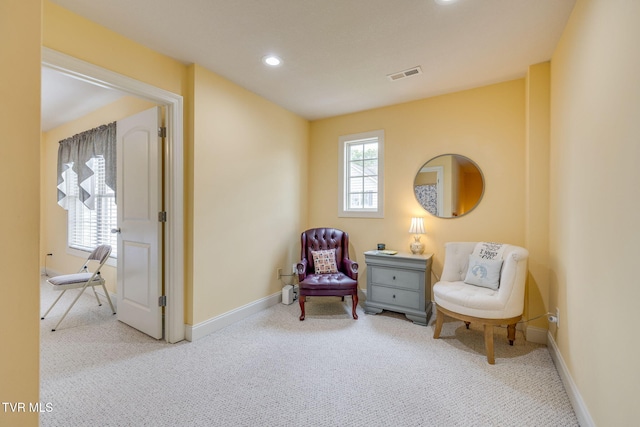 sitting room with carpet flooring, recessed lighting, and baseboards