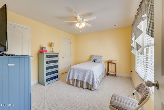 bedroom featuring carpet flooring, baseboards, and ceiling fan