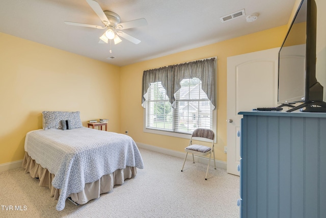 bedroom with baseboards, light carpet, and ceiling fan