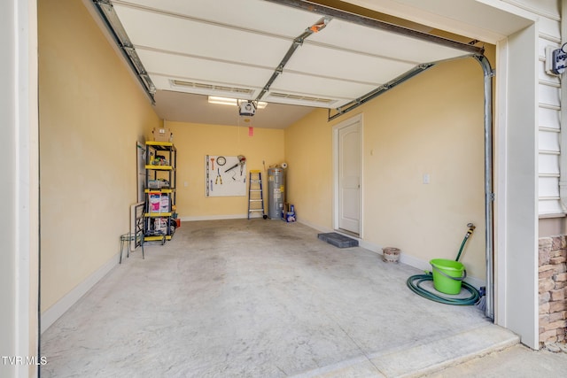 garage with electric water heater and a garage door opener