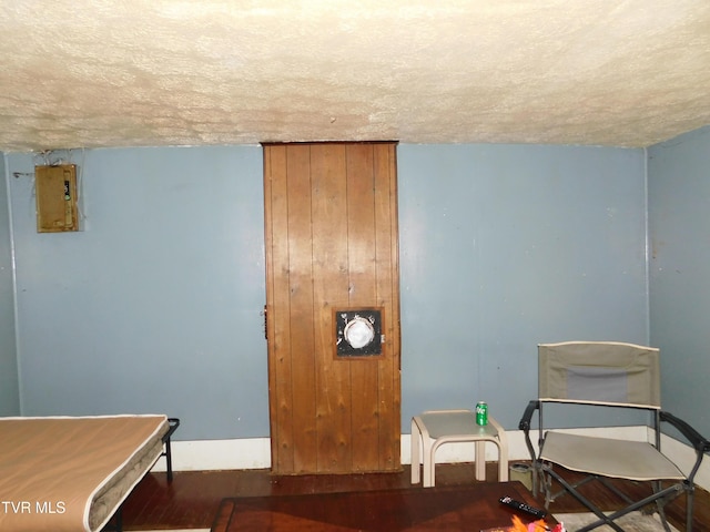 4314 Big Hill Rd, Pennington Gap, VA 24277 - living area featuring a textured ceiling, wood finished floors, and baseboards