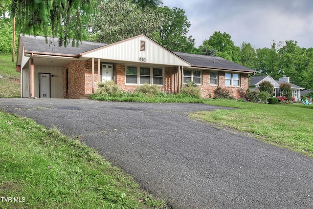 416 Ridgefields Rd, Kingsport, TN 37660 - ranch-style house with asphalt driveway, brick siding, a front lawn, and a carport