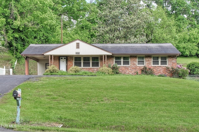 416 Ridgefields Rd, Kingsport, TN 37660 - single story home featuring a front yard, brick siding, asphalt driveway, and an attached carport
