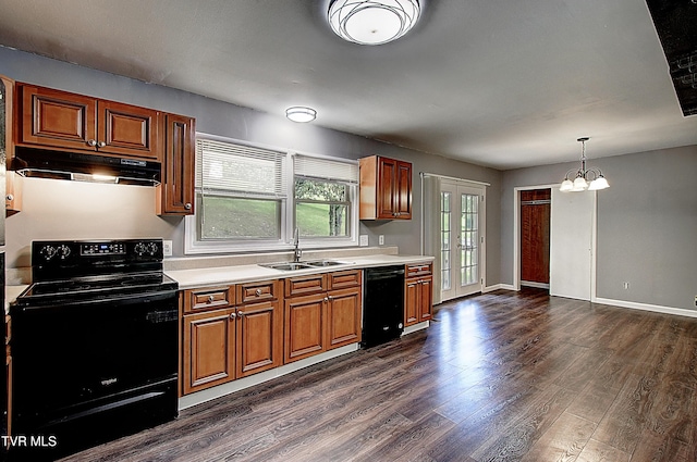 416 Ridgefields Rd, Kingsport, TN 37660 - kitchen with black appliances, under cabinet range hood, a sink, light countertops, and dark wood finished floors