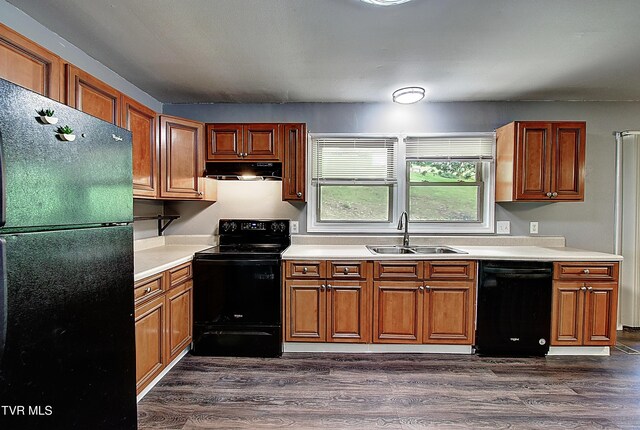 416 Ridgefields Rd, Kingsport, TN 37660 - kitchen with black appliances, a sink, light countertops, under cabinet range hood, and brown cabinets