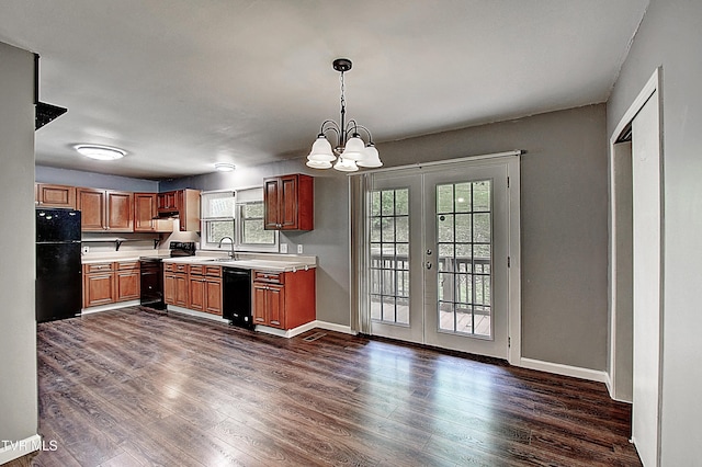 416 Ridgefields Rd, Kingsport, TN 37660 - kitchen with black appliances, light countertops, dark wood-type flooring, and a chandelier