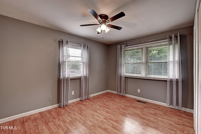416 Ridgefields Rd, Kingsport, TN 37660 - empty room with light wood finished floors, a ceiling fan, and baseboards