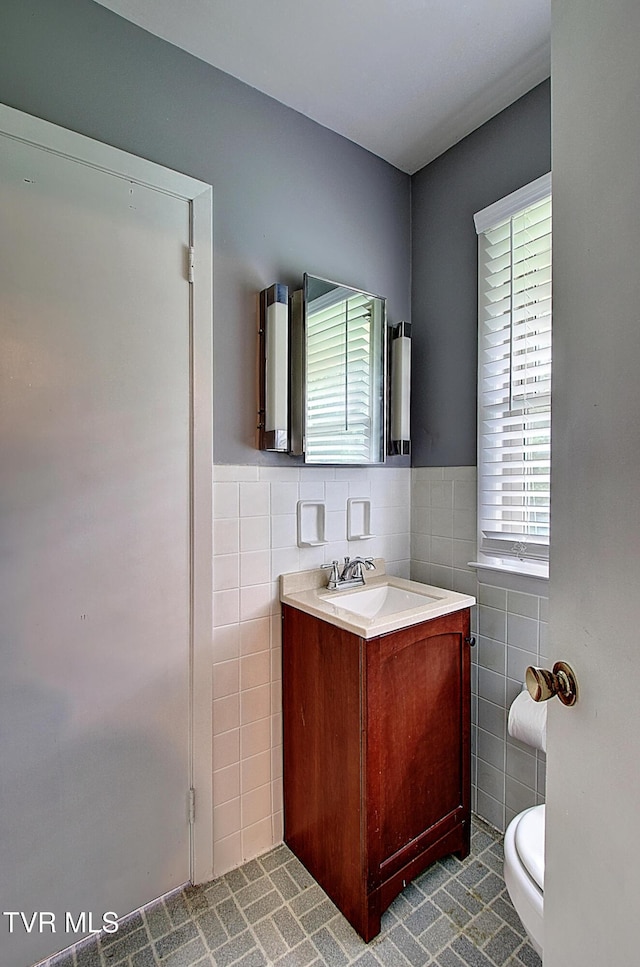 416 Ridgefields Rd, Kingsport, TN 37660 - bathroom with tile walls, tile patterned flooring, vanity, wainscoting, and toilet