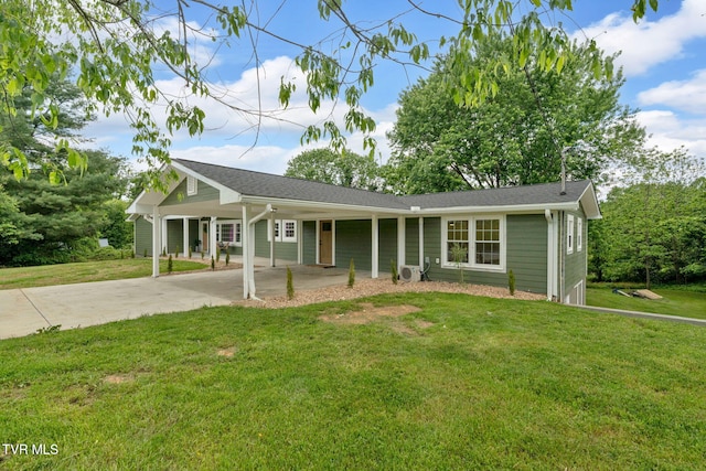 single story home featuring concrete driveway, a front yard, and a carport