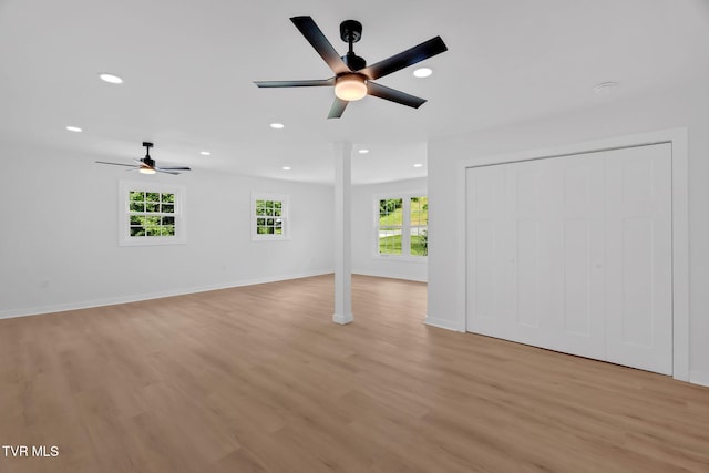 unfurnished living room with ceiling fan, light wood-style flooring, recessed lighting, and baseboards
