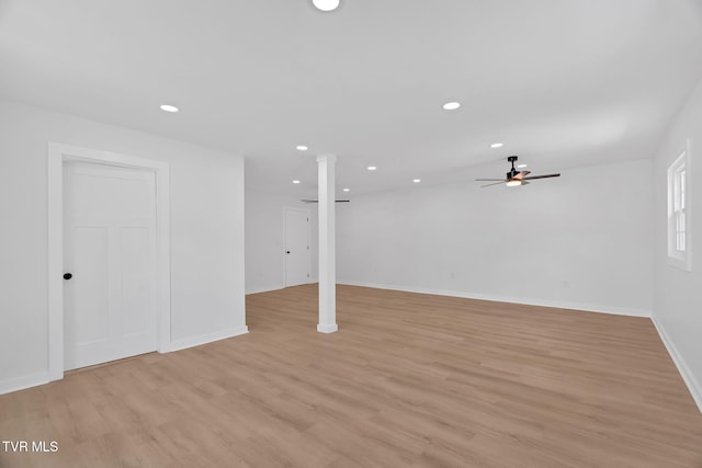 below grade area with ceiling fan, baseboards, recessed lighting, and light wood finished floors