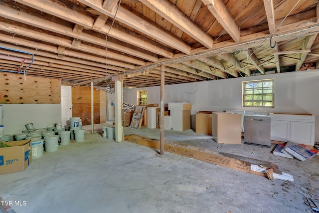 basement featuring refrigerator