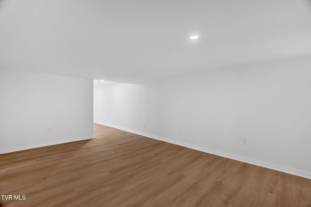 bonus room with wood finished floors, baseboards, and recessed lighting