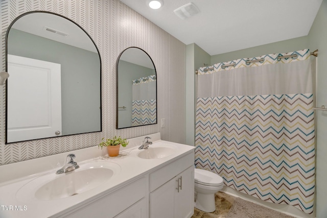 full bath with toilet, double vanity, a shower with shower curtain, and wallpapered walls