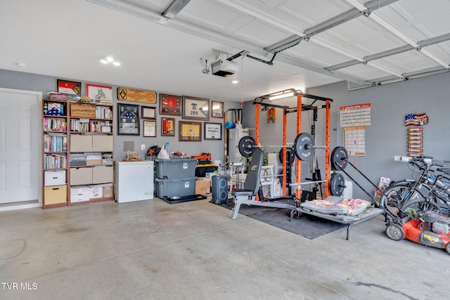garage featuring a garage door opener and fridge